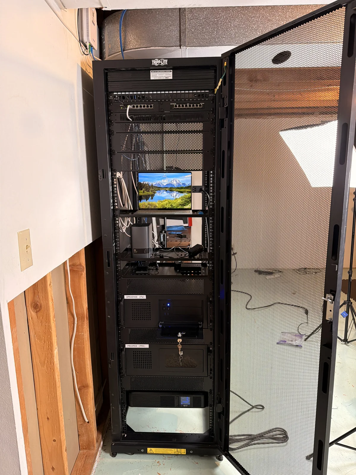 Front view of my home server rack with network equipment, two rack-mounted computers and a UPS